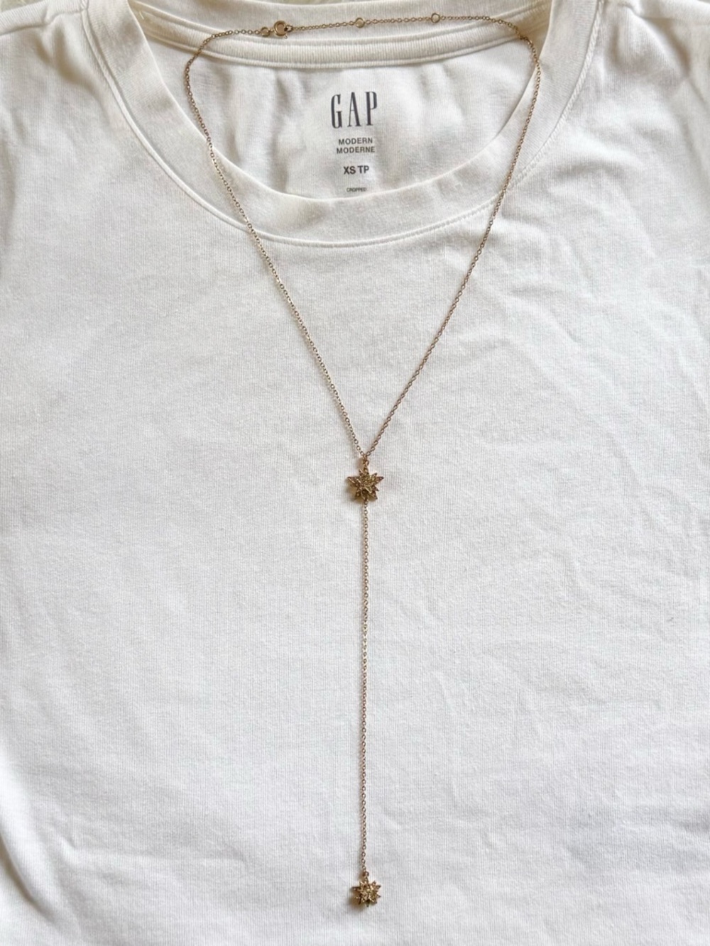 GOLD-TONE star lariat necklace with faux diamond gems